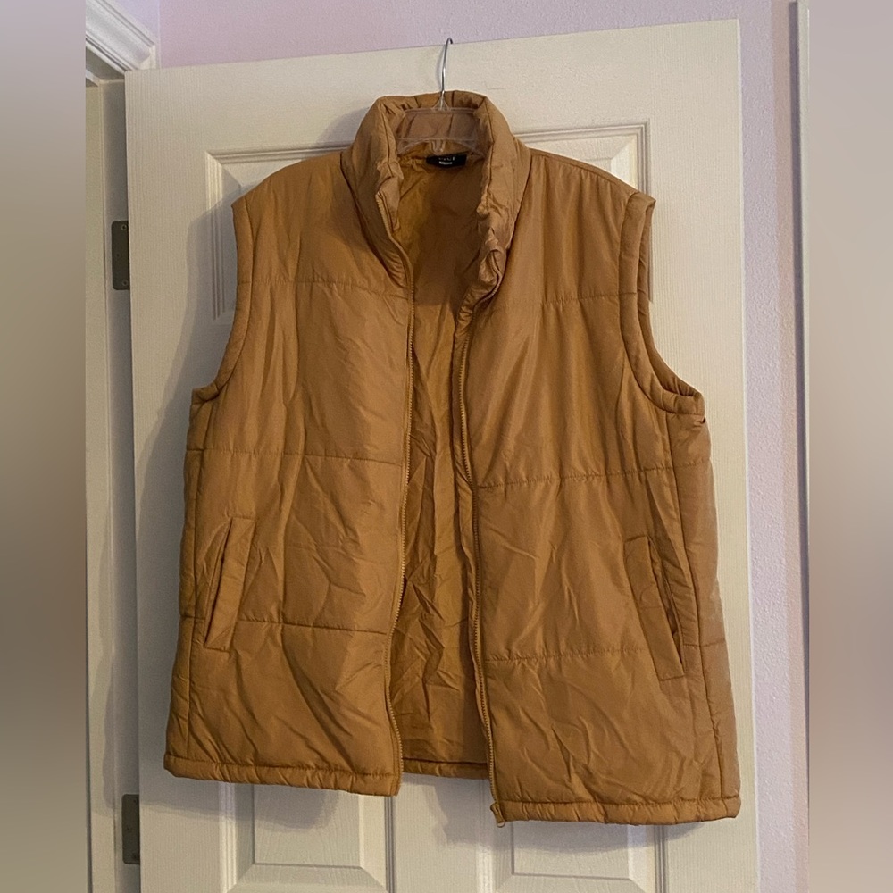 Brand new, very loose fitting vest in tan color